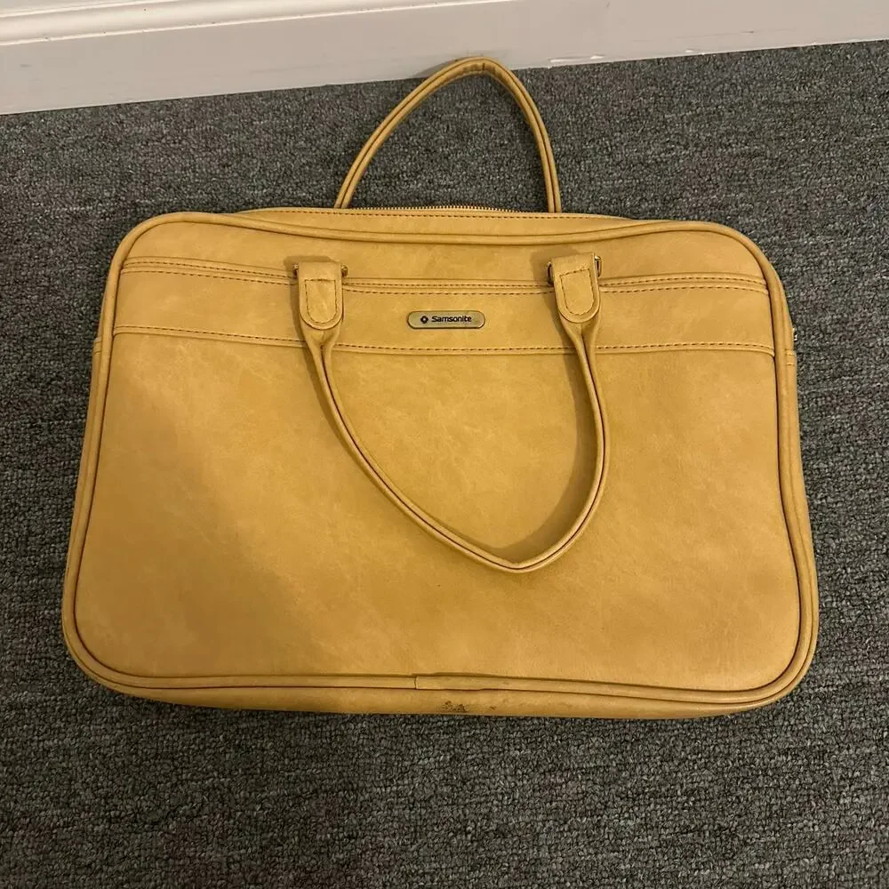 Samsonite Silhouette yellow vinyl carry-on bag